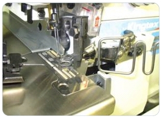 Приспособление UMA-130 для сложения пополам с подачей тесьмы во внутрь шва